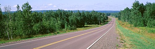 Trees on both sides of a highway, Route 13, Bayfield, Wisconsin, USA