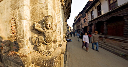 Stone carving on corner of small temple, Durbar Square, Patan, Kathmandu Valley, Nepal, Asia