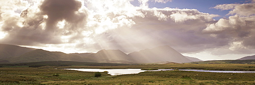 Break in the clouds over Maumturk Mountains, Joyce Country, Connemara, County Galway, Connacht, Republic of Ireland (Eire), Europe