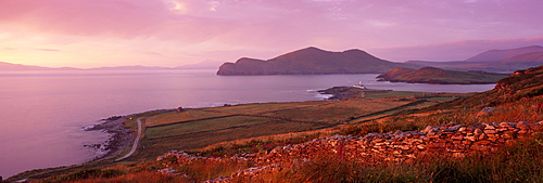 Lighthouse, Beginish island, Doulus Bay and Doulus Head in the distance, at sunset, viewed from Valentia island, Ring of Kerry, Munster, Republic of Ireland, Europe