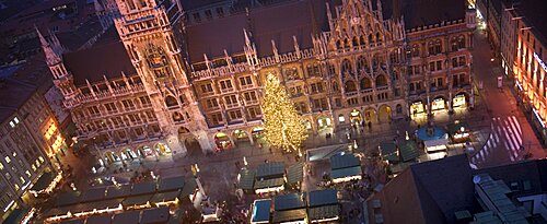 GERMANY Munich Panoramic view of the Christmas Market beneath the Rathaus. Christkindlesmarkt  Festive Advent Yuletide Travel Holidays Christmas Tree Fairy Lights Rathaus Panorama