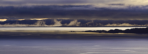 Panoramic view of dawn breaking across the sound of Raasay and the Isle of Rona taken from the Isle of Skye, Inner Hebrides, Scotland, United Kingdom, Europe