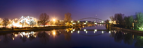 Christmas circus at the Cannstatter Wasen festival area reflected in the Neckar River, Stuttgart, Baden-Wuerttemberg, Germany, Europe