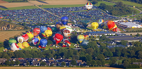 Aerial view, 20th Warsteiner Montgolfiade, hot air balloon festival with nearly 200 hot air balloons ascending into the sky, Warstein, Sauerland, North Rhine-Westphalia, Germany, Europe