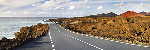 Road on the west coast through a volcanic landscape, Lanzarote, Canary Islands, Spain, Europe