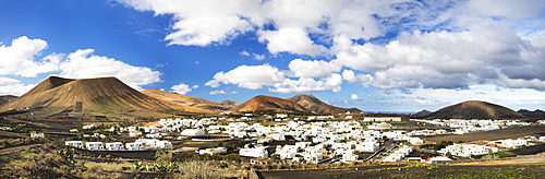 The white village of Uga surrounded by mountains in the middle of a lava landscape, Lanzarote, Canary Islands, Spain, Europe