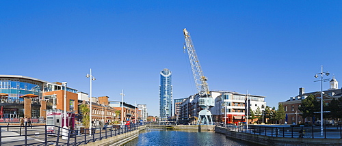 Panorama of Gunwharf Quays with dock crane and The Number One Tower or Lipstick, Portsmouth, Hampshire, England, United Kingdom, Europe