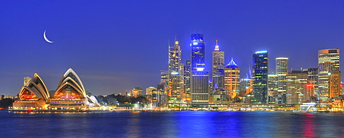 Panorama shot of Sydney Opera House, Sydney Harbour Bridge, Harbour, Sydney skyline, Central Business District, moon, night, Sydney, New South Wales, Australia