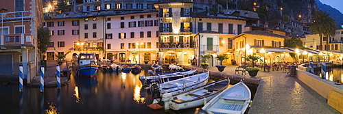 Illuminated promenade at the port of Limone in the evening, Lake Garda, Lombardy, Italy, Europe