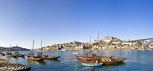 Port wine boats, at back the Ponte de Dom Luis I Bridge, Rua Diogo Leite, Rio Duoro River, Porto, UNESCO World Cultural Heritage Site, Portugal, Europe