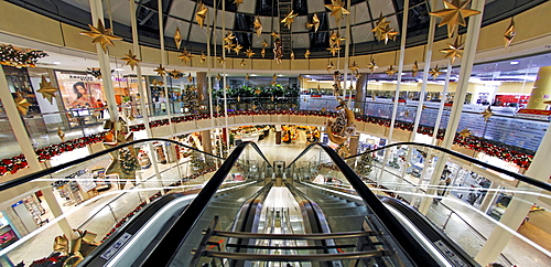 Christmassy decorated shopping centre with escalator, City Point, Nuremberg, Middle Franconia, Bavaria, Germany, Europe