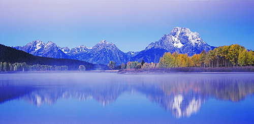 Mt. Moran and Teton Range reflected in Snake River at dawn, Oxbow Bend, Grand Teton National Park, Wyoming, USA