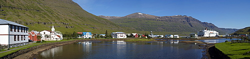 The ferry Norrona in the harbour of Seyï£¿isfjoï£¿ur and old wooden buildings Iceland