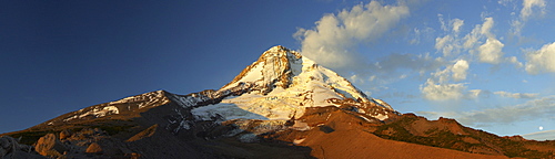 Mount Hood illuminated by the first light of day in the Cascade Range in northern Oregon seen from Cloud Cap, Oregon, United States