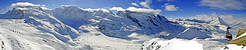 Panoramic shot, ski resort Zermatt with (from left to right) Monte Rosa, Lisskamm , Pollux, Castor, Breithorn-Massive, Matterhorn and gondola to the Stockhorn, Valais, Switzerland