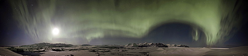 Panoramic view, green Northern Lights, Aurora Borealis, with the moon above the Joekulsarlon glacial lagoon and the Breidamerkurjoekull, Breidamerkurjoekull and Vatnajoekull glaciers, Vatnajoekull National Park, Iceland, Europe