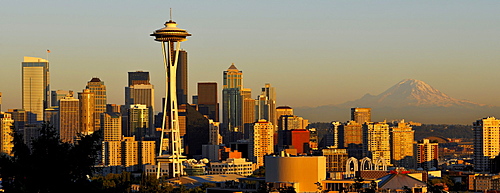 Skyline at dusk, Seattle financial district with Space Needle, Mount Rainier at back, Columbia Center, formerly Bank of America Tower, Washington Mutual Tower, Two Union Square Tower, Municipal Tower, formerly Key Tower, U.S. Bank Center, Seattle, Washing