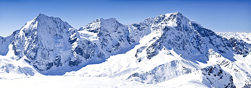 View from the peak of the rear of Schoentaufspitze mountain, Solda in winter, looking towards Koenigsspitze and Zebru mountains and the Ortler Range, Alto Adige, Italy, Europe