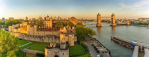 View of the Tower of London, UNESCO World Heritage Site, and Tower Bridge from Cheval Three Quays at sunset, London, England, United Kingdom, Europe