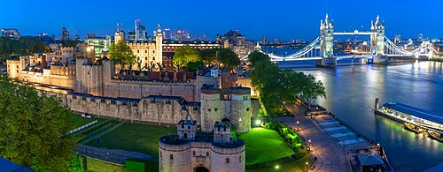 View of the Tower of London, UNESCO World Heritage Site, and Tower Bridge from Cheval Three Quays at dusk, London, England, United Kingdom, Europe