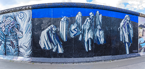 View of artwork at Berliner Mauer, Eastside section of the former Berlin Wall along the Spree River, Berlin, Germany, Europe