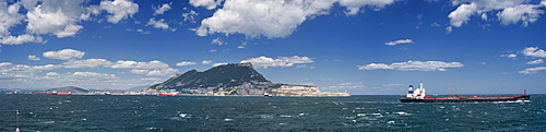 12/04/2009. United Kingdom, City of Gibraltar, Rock of Gibraltar, entering harbour of Gibraltar, ships, cargo ships . City Of Gibraltar, St Michalel's Cave, Gibraltar Strait . UK, United Kingdom