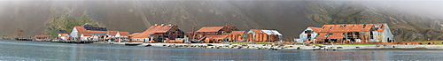 A panoramic view of the abandoned Norwegian whaling station in the fog at Stromness Bay on South Georgia Island, Southern Ocean