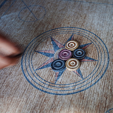 Kabbadi, a traditional Indian and Sri Lankan board game where teams of two must flick their pieces into corners around the edge of the board, Sri Lanka, Asia 