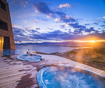 Outdoor swimming pool and jacuzzi at sunset, Hotel Arakur Ushuaia Resort and Spa, Ushuaia, Tierra del Fuego, Patagonia, Argentina, South America