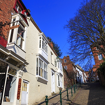 Historic buildings line cobbled Steep Hill, voted Britain's Great Street 2012, Cathedral Quarter, Lincoln, Lincolnshire, England, United Kingdom, Europe