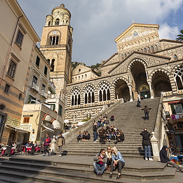 People in the sun on cathedral steps in spring, Amalfi, Costiera Amalfitana (Amalfi Coast), UNESCO World Heritage Site, Campania, Italy, Europe