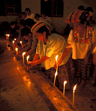 Guatemala catholic church, lighting candles peten