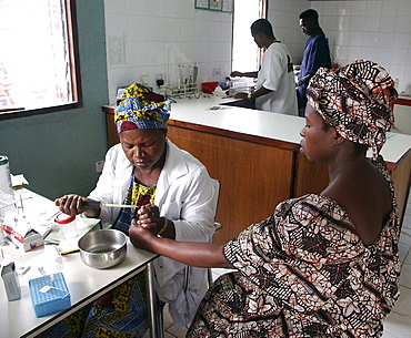 Gambia taking blood for hiv at wec clinic birkana