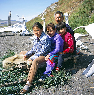 Eskimos, sledge and whale bones at Yanrakino village (population 150), Chukchi Peninsula, Russian Far East, Russia, Asia