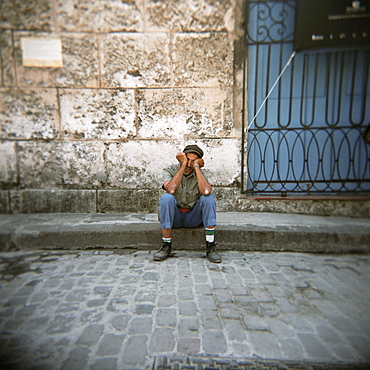 Man sleeping, Plaza Viejo, Havana, Cuba, West Indies, Central America