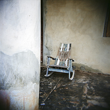 Old wooden chair on porch, Vinales, Cuba, West Indies, Central America