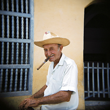 Old man smoking cigar, Trinidad, Cuba, West Indies, Central America