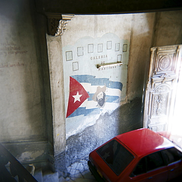 Mural of Camilo Cienfuegos on the wall of an apartment building, Havana, Cuba, West Indies, Central America