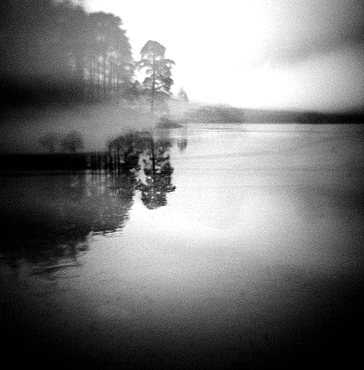 Image taken with a Holga medium format 120 film toy camera of misty view of Blea Tarn at dawn, Lake District, Cumbria, England, United Kingdom, Europe