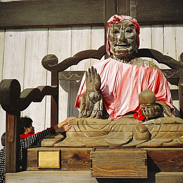 Buddhist Todai-ji Temple, image of Binzuru - touching it is supposed to cure illness, Nara, Japan