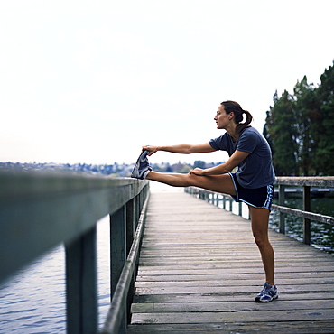 Young woman prepares for jogging