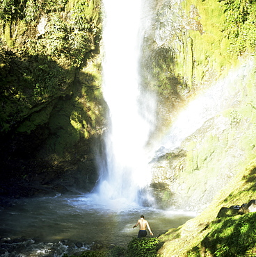 Man takes a bath in waterfall, Los Chorros Falls, Poas Valley, Costa Rica, Central America
