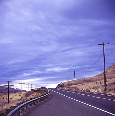 Empty road with power poles on both sides, Eastern Washington State, United States of America, North America