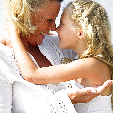 Grandmother and grandaughter (6-8) outdoors