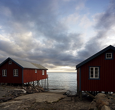 Rorbuer on stilts at waters edge, Lofoten Islands, Norway, Scandinavia, Europe