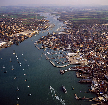 Aerial image of Cowes, on the west bank of the estuary of the River Medina facing the smaller town of East Cowes on the east bank, Isle of Wight., England, United Kingdom, Europe