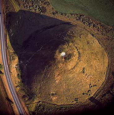 Aerial image of Silbury Hill, a prehistoric human-made chalk and clay mound near Avebury, UNESCO World Heritage Site, Wiltshire, England, United Kingdom, Europe