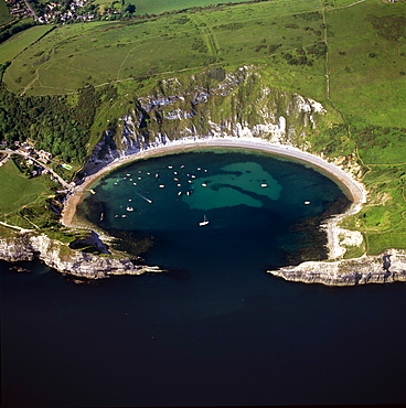 Aerial image of Lulworth Cove, a natural landform harbour, near West Lulworth, on the Jurassic Coast, UNESCO World Heritage Site, Dorset, England, United Kingdom, Europe