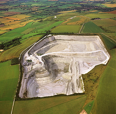 Aerial image of Westbury chalk quarry, with Westbury White Horse and Bratton Camp Hill Fort in background, Wiltshire, England, United Kingdom, Europe