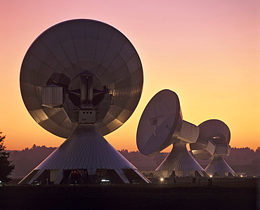 Dusk, lit antennas of the ground communication station Raisting, Upper Bavaria, Germany